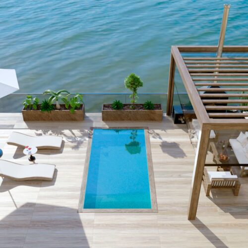 3d render Top view of luxury patio with sea view and swimming pool
